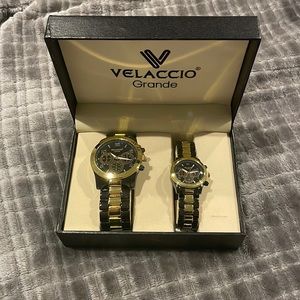Pair of Men’s and women’s matching watches.  Never worn. Dark gray and gold
